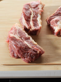 Close-up of meat on cutting board