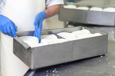 Midsection of man preparing food