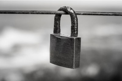 Close-up of padlocks on railing