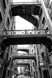 Low angle view of bridge in city