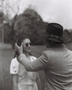 Portrait of woman wearing sunglasses standing outdoors