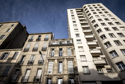 Low angle view of skyscrapers against sky