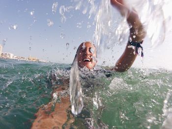 Happy woman swimming in sea