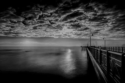 Pier over sea against sky