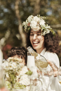 Young woman holding flower bouquet