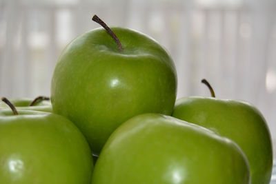 Close-up of apple on green table