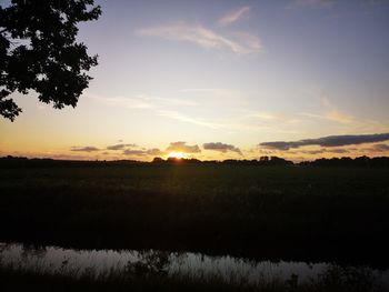Scenic view of silhouette landscape against sky during sunset