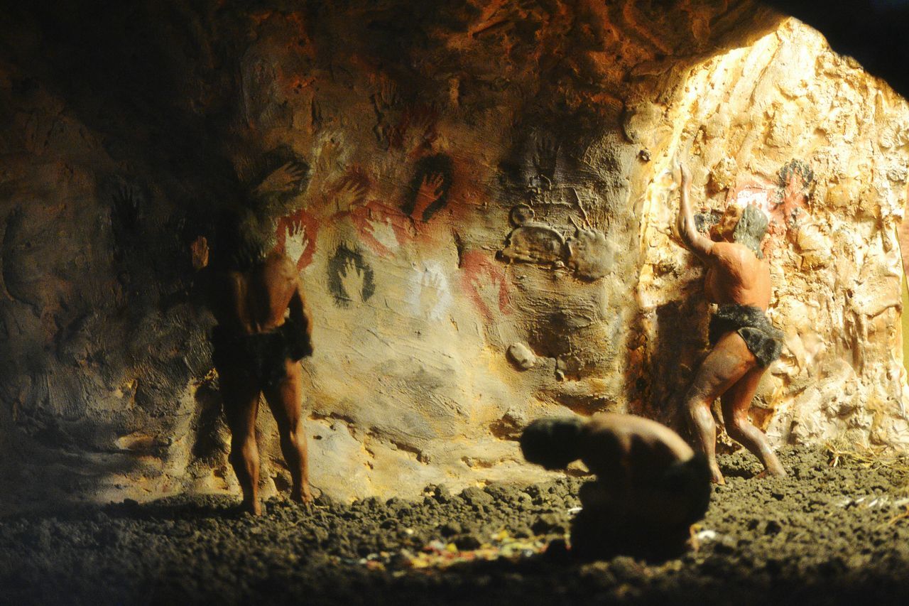 real people, rock - object, men, cave, standing, togetherness, outdoors, night, nature, mammal, people