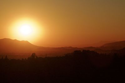 Scenic view of mountains against sky during sunset