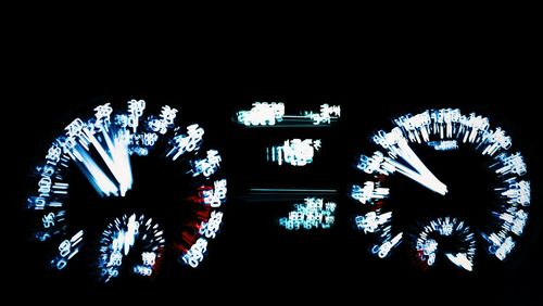 Illuminated ferris wheel at night