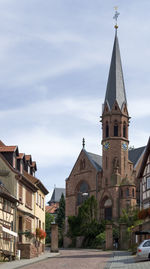 View of buildings in city against sky