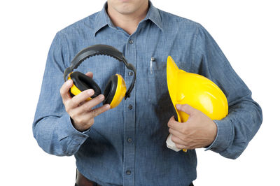 Midsection of man holding ice cream against white background