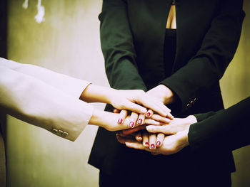 Midsection of woman holding hands