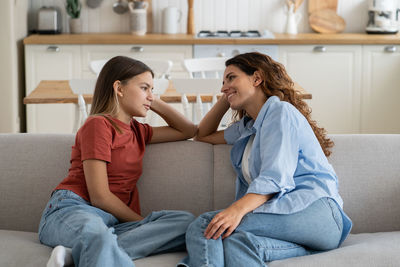 Happy family sitting at home