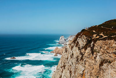 Scenic view of sea against clear blue sky