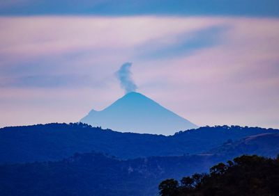 Scenic view of volcanic mountain against sky