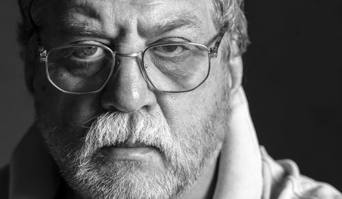 Close-up portrait of man wearing eyeglasses