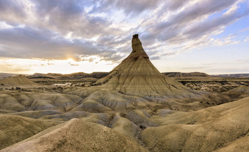 Scenic view of desert against sky during sunset