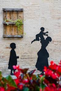 Shadow of man and woman statue
