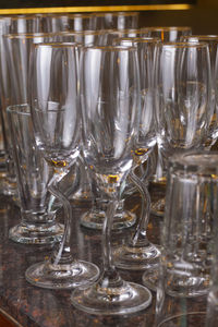 Close-up of wine glasses on table