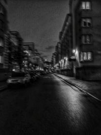 Cars on road in city at night