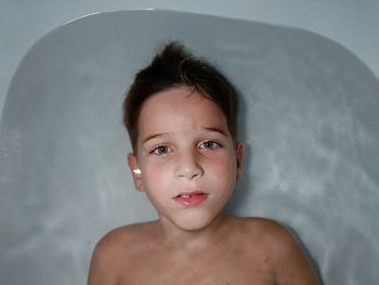 Close-up portrait of shirtless boy