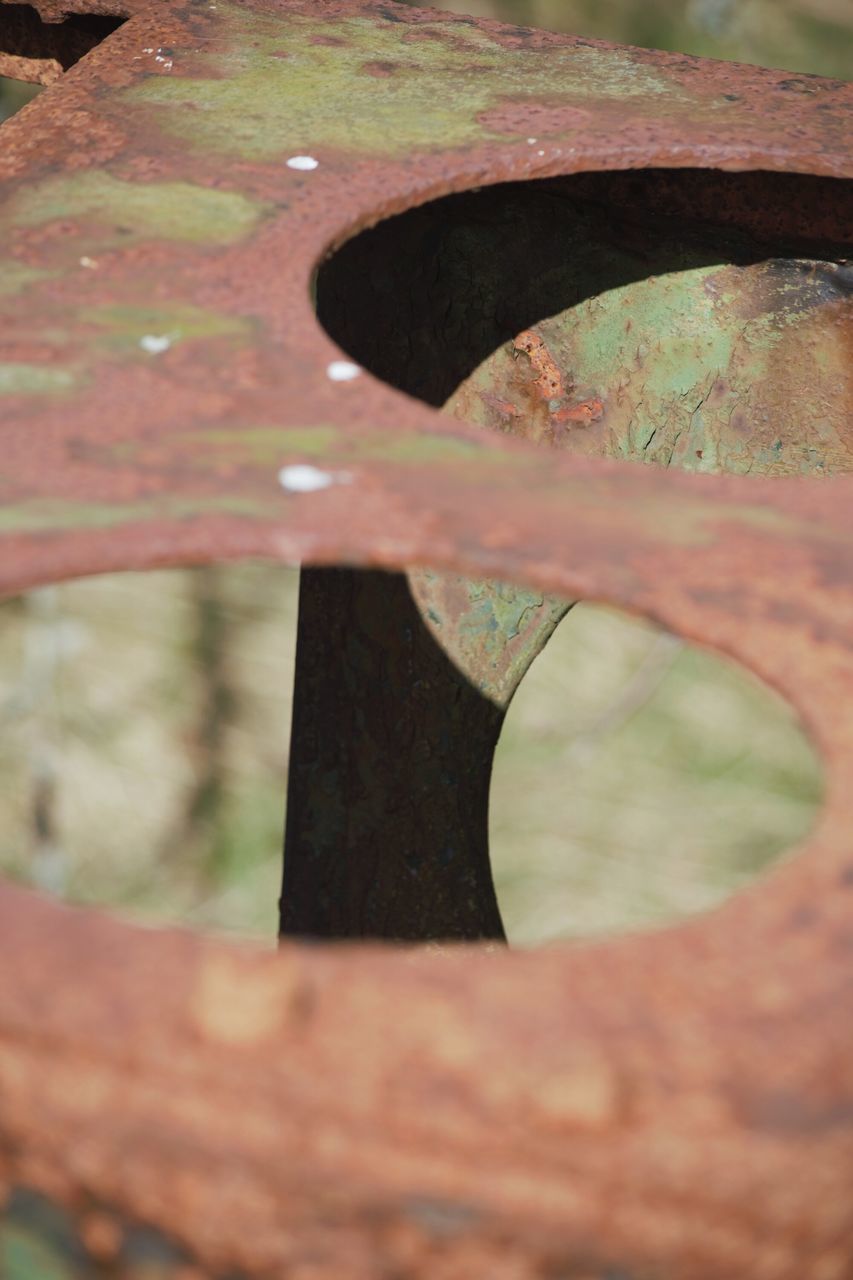 close-up, selective focus, focus on foreground, water, reflection, day, leaf, outdoors, nature, wet, part of, one person, high angle view, focus on background, textured, wood - material, season, pattern, built structure