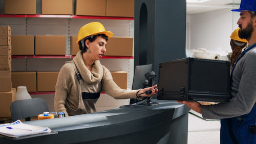 Portrait of young man working in office