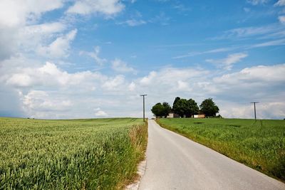 Country road passing through field