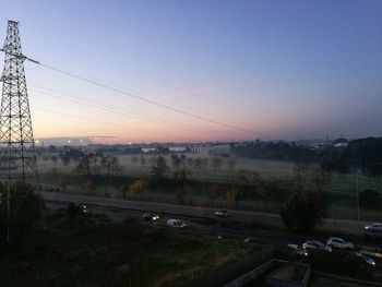 Road against clear sky during sunset