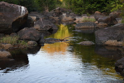 Scenic view of rock formation in lake