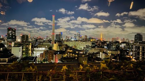 High angle view of city buildings against sky