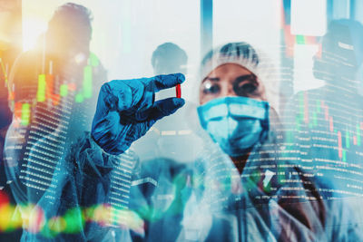 Digital composite image of man with arms raised