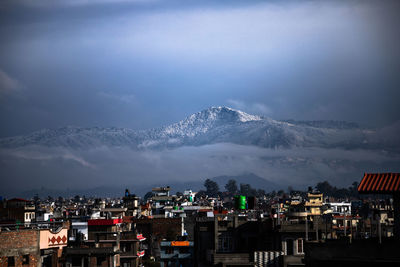 Hills around kathmandu valley surrounded with snow as seen from kathmandu valley