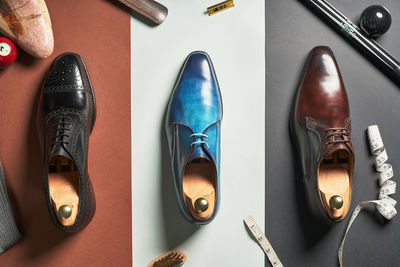 High angle view of shoes on red background