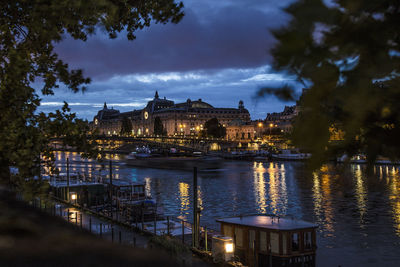 Illuminated buildings at waterfront