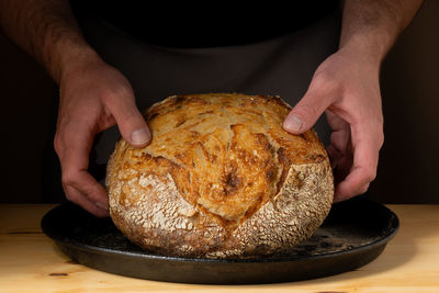 Midsection of man preparing food