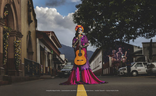 Woman standing on street in city