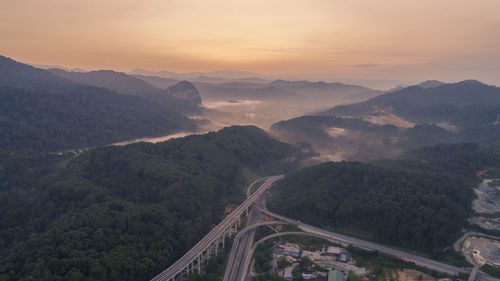 High angle view of mountains against sky during sunset