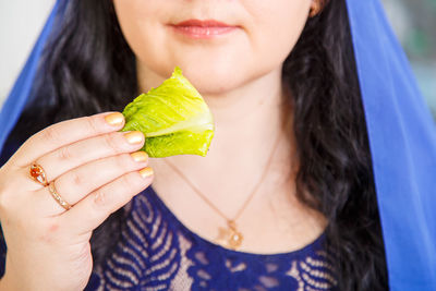 Close-up portrait of a woman holding ice cream