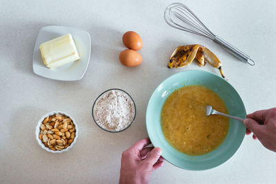 Overhead view of a young man making cookies at the kitchen