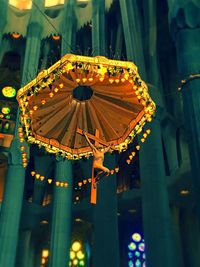 Low angle view of illuminated lights at night