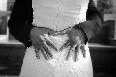 Close-up of hands making heart shape