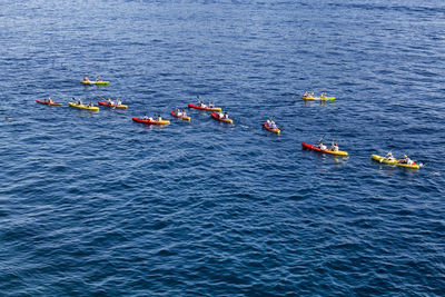 High angle view of people on boat in sea