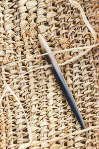 High angle view of wicker basket on brick wall