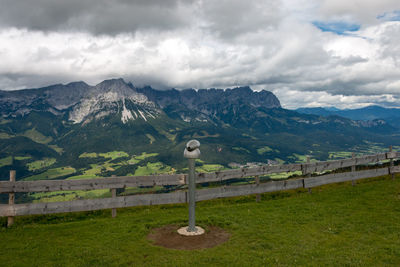 Bird on mountain range against sky