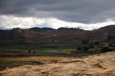 Scenic view of landscape and mountains against sky