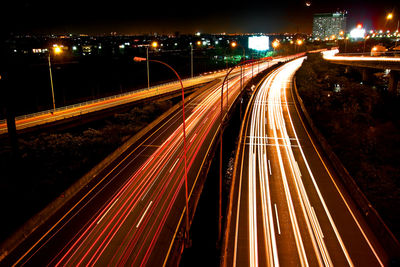 High angle view of light trails on road at night