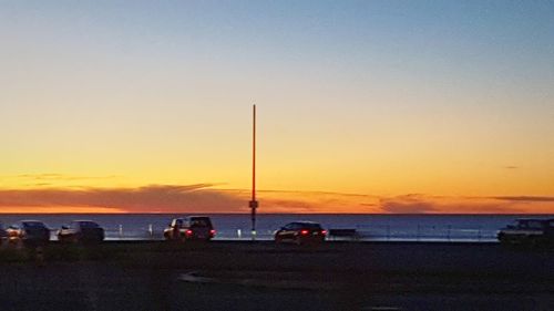 Scenic view of beach against sky during sunset