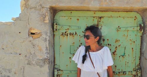 Woman standing in old building